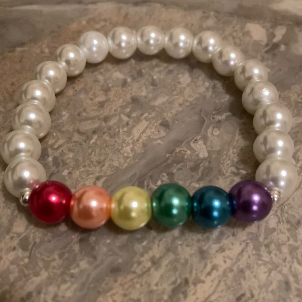 6 3/4”- 7” wrist: Rainbow glass PRIDE white bracelet: Double glued/hidden knot.